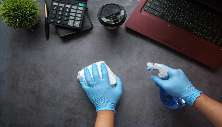 Professional cleaning team sanitizing office desks in Halifax