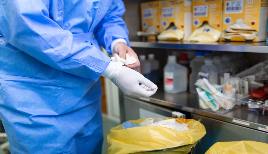 Laboratory cleaner sanitizing fume hood in Halifax lab